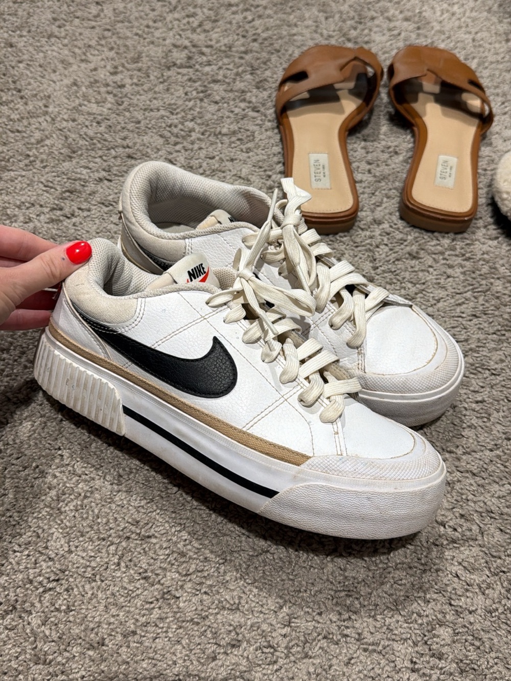 Nike Women's White Sneakers with Black Swoosh and Tan Accent